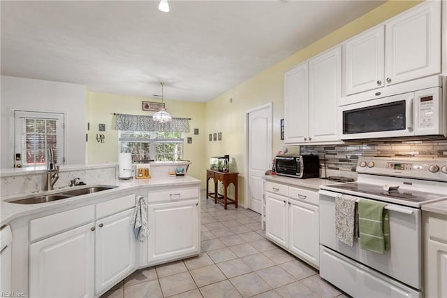 106 Elm Tree Ct, Suffolk, VA 23435 - kitchen featuring tasteful backsplash, white appliances, light countertops, and a sink