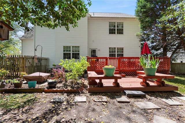 106 Elm Tree Ct, Suffolk, VA 23435 - back of property featuring a deck, fence, and a shingled roof