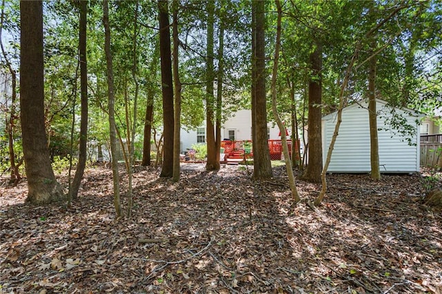 106 Elm Tree Ct, Suffolk, VA 23435 - view of yard with a wooden deck, fence, and an outdoor structure