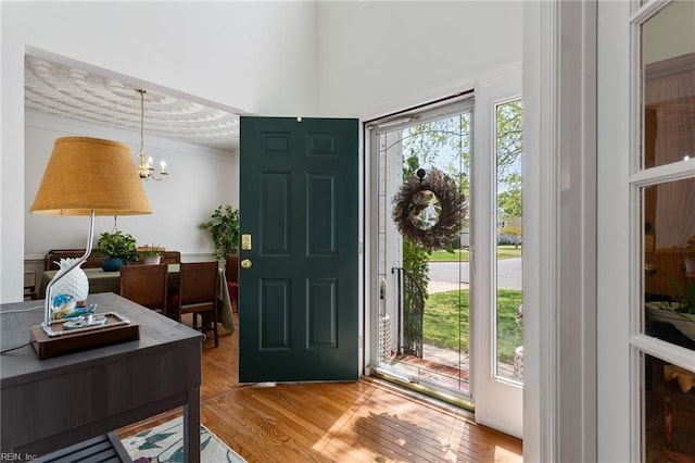 106 Elm Tree Ct, Suffolk, VA 23435 - entrance foyer with a chandelier, light wood-type flooring, and ornamental molding