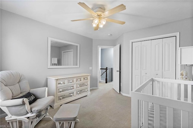 bedroom featuring a ceiling fan, baseboards, carpet floors, and a closet