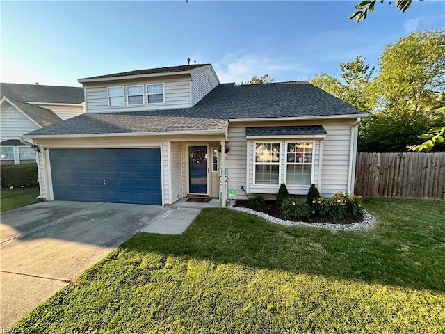 traditional-style home featuring roof with shingles, concrete driveway, a front lawn, and fence