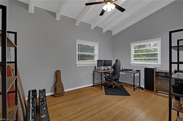 office space with wood finished floors, vaulted ceiling with beams, baseboards, and a ceiling fan
