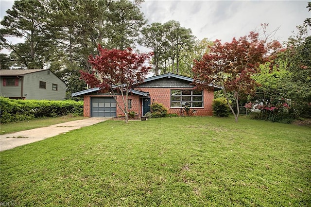 view of front facade featuring brick siding, a front lawn, driveway, and an attached garage