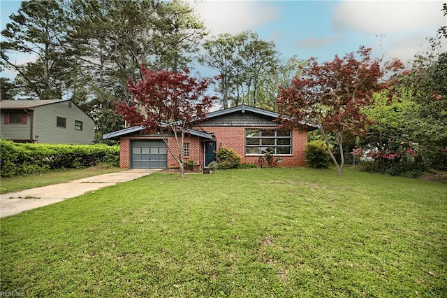 view of front of house featuring driveway, brick siding, a front yard, and a garage