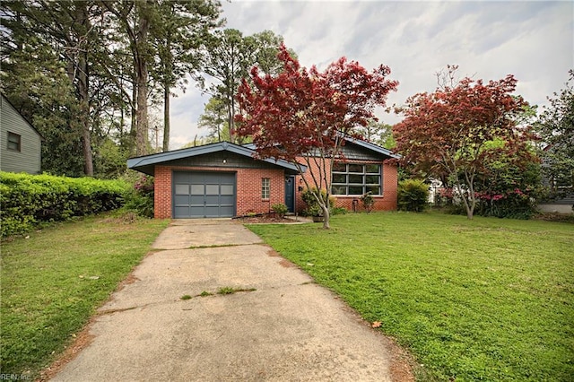 view of front of property featuring an attached garage, a front lawn, brick siding, and concrete driveway
