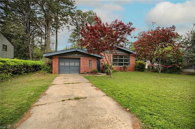 view of front of home with concrete driveway, a front lawn, and brick siding