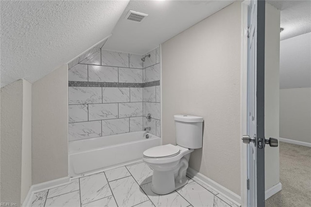 full bathroom featuring baseboards, toilet, a textured ceiling, and marble finish floor
