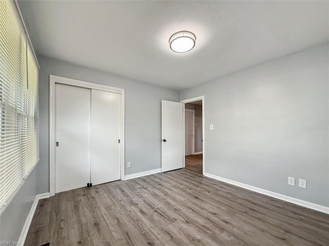 122 Kendall Dr, Newport News, VA 23601 - unfurnished bedroom featuring wood finished floors, baseboards, and a closet