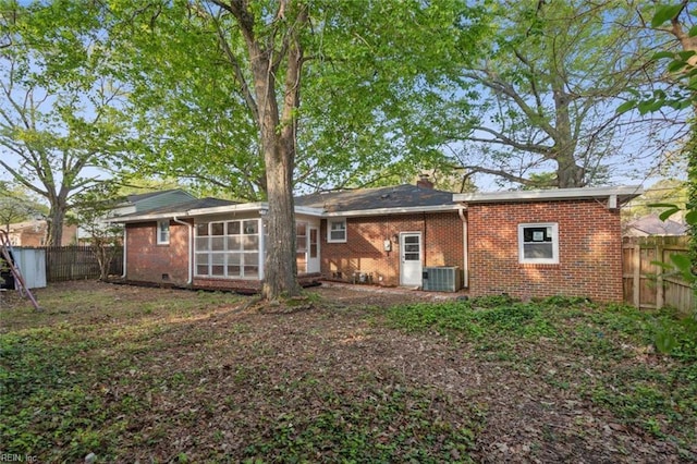 122 Kendall Dr, Newport News, VA 23601 - rear view of house with brick siding, fence, central AC, and a sunroom
