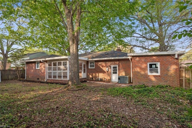 122 Kendall Dr, Newport News, VA 23601 - back of house featuring a sunroom, brick siding, fence, and central AC unit