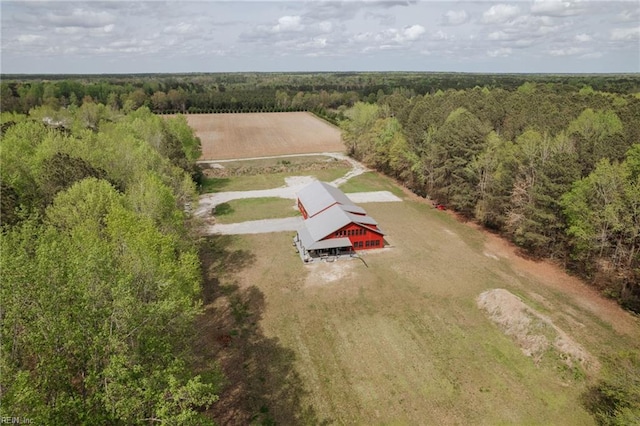 drone / aerial view with a wooded view