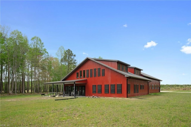 rear view of house with a yard