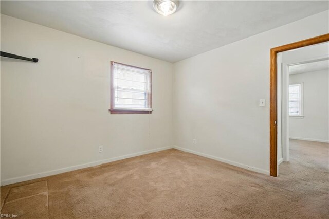 6525 Cabot Ave, Norfolk, VA 23502 - carpeted empty room with plenty of natural light and baseboards