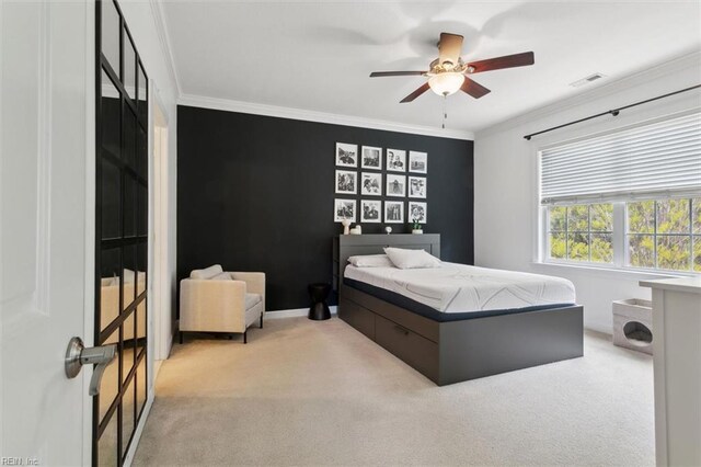 bedroom featuring crown molding, visible vents, and light colored carpet