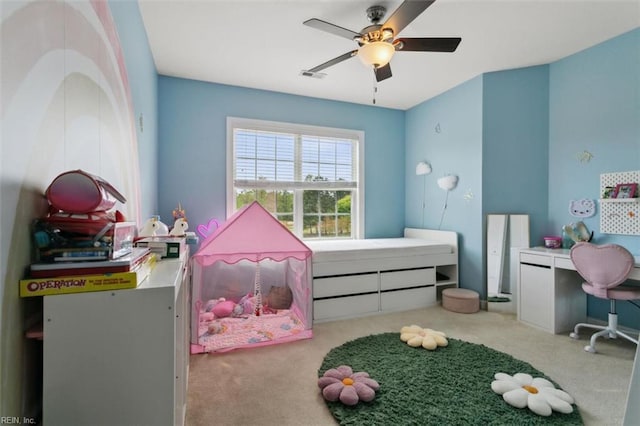 carpeted bedroom with visible vents and ceiling fan
