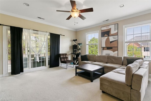carpeted living room featuring recessed lighting, visible vents, ornamental molding, and ceiling fan