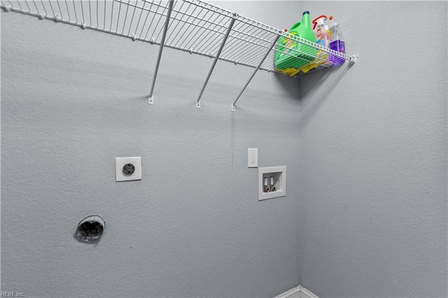 washroom featuring electric dryer hookup, hookup for a washing machine, and laundry area