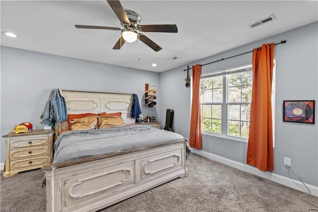 bedroom with carpet, visible vents, baseboards, and ceiling fan