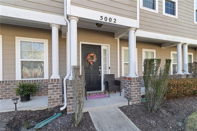 doorway to property featuring a porch