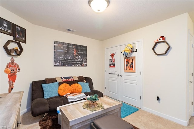 living room with carpet flooring, baseboards, and visible vents