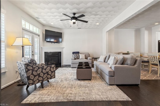 209 Cobblestone Reach Reach, Suffolk, VA 23435 - living area featuring recessed lighting, a ceiling fan, a glass covered fireplace, and dark wood-style floors