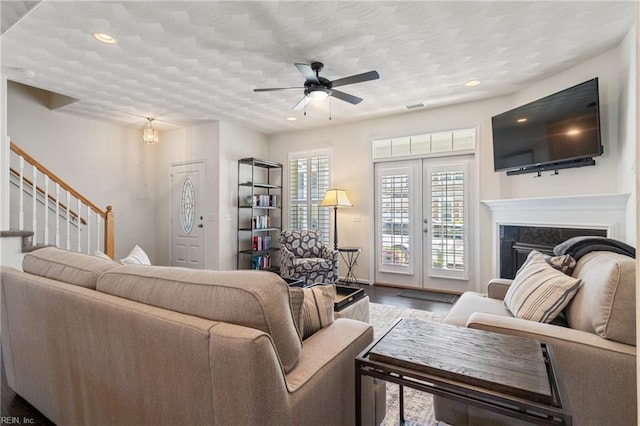 209 Cobblestone Reach Reach, Suffolk, VA 23435 - living room with wood finished floors, ceiling fan, recessed lighting, and stairway