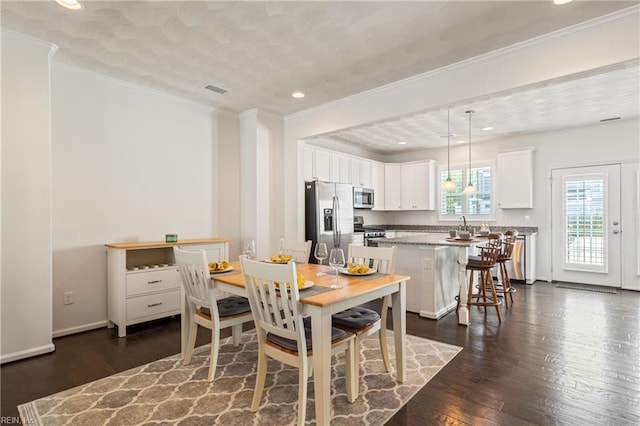 209 Cobblestone Reach Reach, Suffolk, VA 23435 - dining room with ornamental molding, visible vents, recessed lighting, dark wood-style flooring, and baseboards