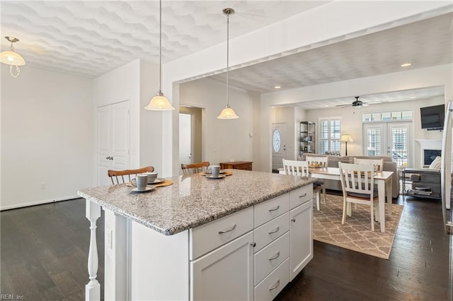 209 Cobblestone Reach Reach, Suffolk, VA 23435 - kitchen with open floor plan, pendant lighting, dark wood-style flooring, and a kitchen island