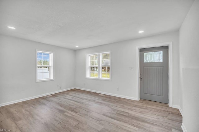 9289 Gates Rd, Suffolk, VA 23437 - entrance foyer featuring recessed lighting, plenty of natural light, light wood finished floors, and baseboards