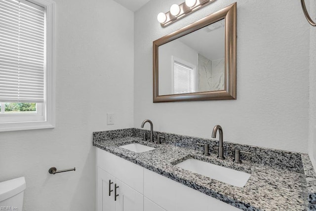9289 Gates Rd, Suffolk, VA 23437 - bathroom with toilet, double vanity, and a sink