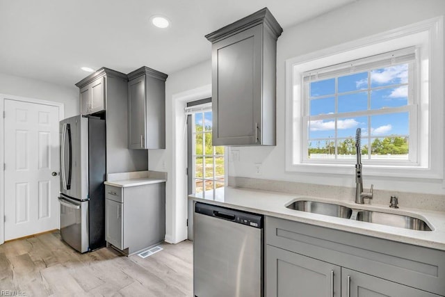 9289 Gates Rd, Suffolk, VA 23437 - kitchen with gray cabinets, a sink, visible vents, and stainless steel appliances