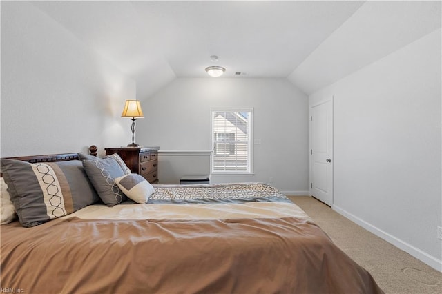 carpeted bedroom with lofted ceiling, visible vents, and baseboards