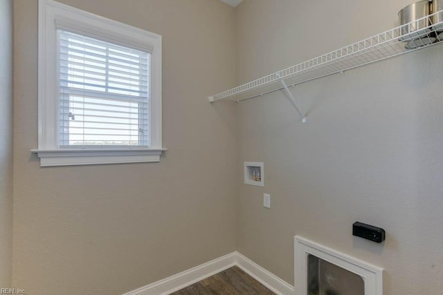 laundry area with washer hookup, laundry area, dark wood-style flooring, and baseboards