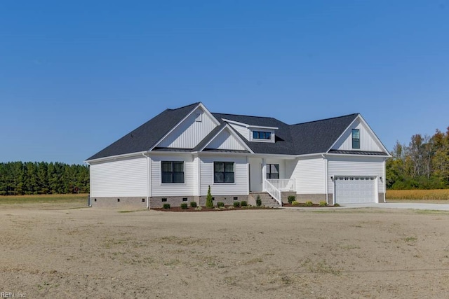 modern farmhouse style home featuring crawl space, a shingled roof, an attached garage, and driveway