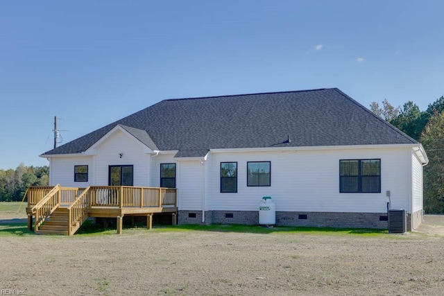rear view of property featuring central AC, a wooden deck, crawl space, and roof with shingles