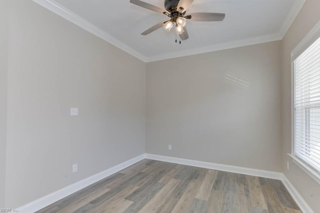 unfurnished room with crown molding, baseboards, ceiling fan, and wood finished floors
