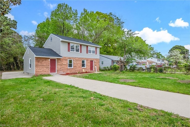 105 Ireland St, Hampton, VA 23663 - view of front of home featuring brick siding and a front yard