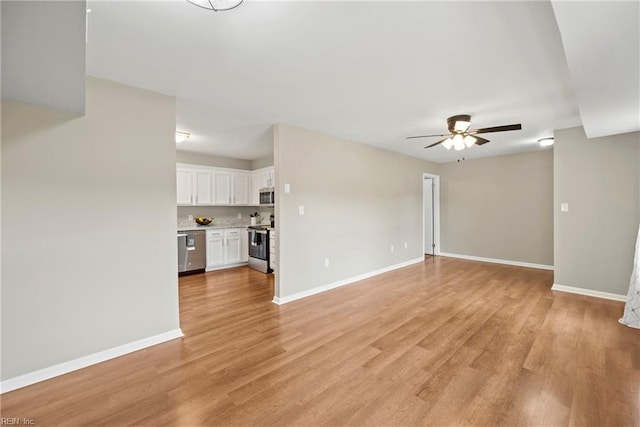 105 Ireland St, Hampton, VA 23663 - unfurnished living room with light wood-style flooring, baseboards, and a ceiling fan