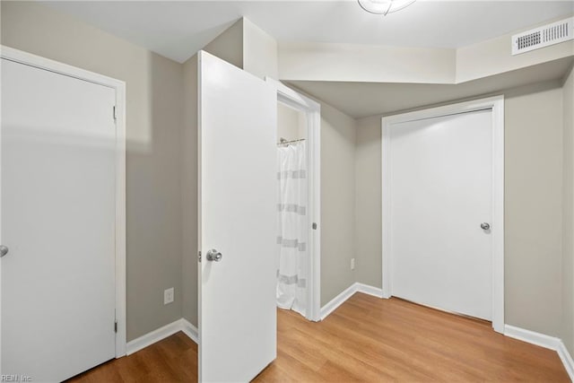 105 Ireland St, Hampton, VA 23663 - unfurnished bedroom featuring visible vents, light wood-type flooring, and baseboards