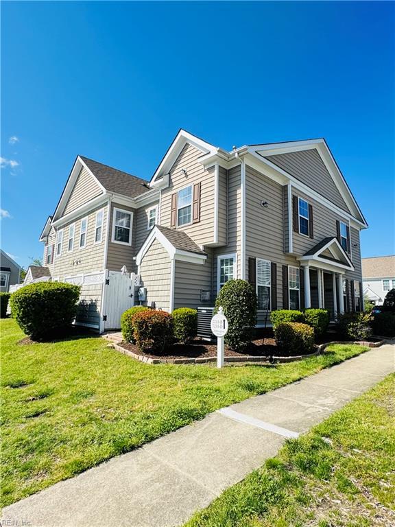view of property exterior featuring a lawn and fence