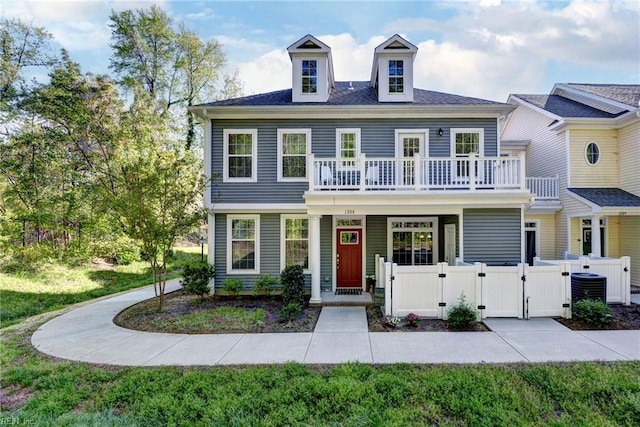 1208 Kings Land Ct, Williamsburg, VA 23185 - view of front facade featuring a gate, central AC unit, a balcony, and fence