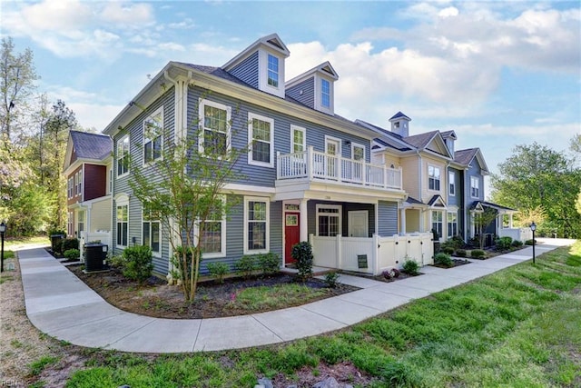 1208 Kings Land Ct, Williamsburg, VA 23185 - multi unit property with a front lawn, a balcony, and central air condition unit
