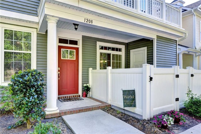1208 Kings Land Ct, Williamsburg, VA 23185 - doorway to property featuring a gate, a balcony, a porch, and fence