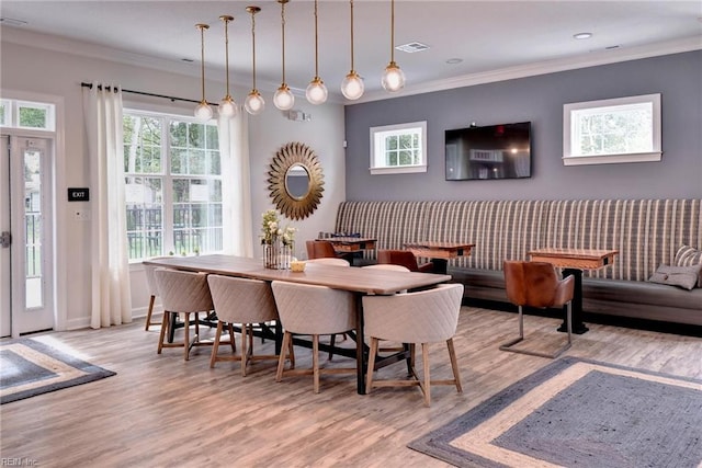 1208 Kings Land Ct, Williamsburg, VA 23185 - dining room featuring light wood-type flooring, visible vents, baseboards, and ornamental molding