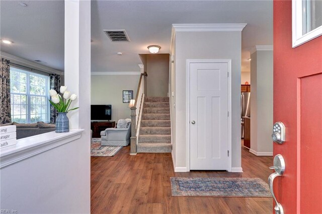 1208 Kings Land Ct, Williamsburg, VA 23185 - entryway featuring wood finished floors, visible vents, crown molding, baseboards, and stairs