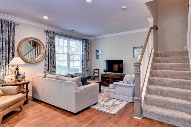 1208 Kings Land Ct, Williamsburg, VA 23185 - living area with visible vents, wood finished floors, stairway, and crown molding