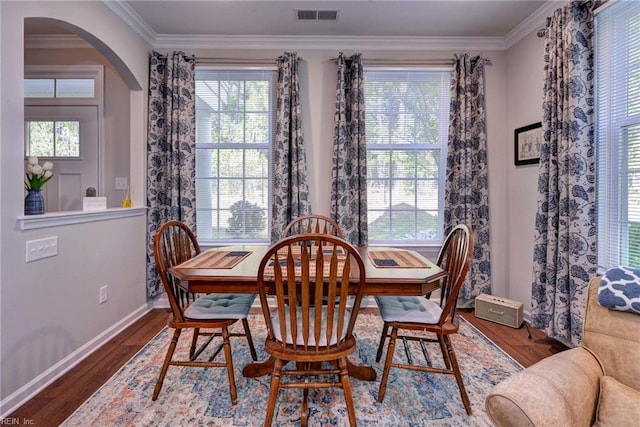 1208 Kings Land Ct, Williamsburg, VA 23185 - dining area featuring wood finished floors, visible vents, arched walkways, and ornamental molding