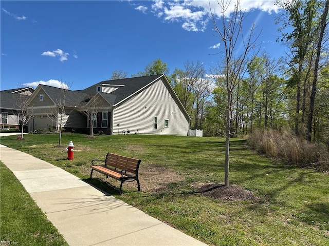 view of property's community with a yard