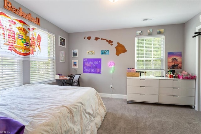 bedroom featuring carpet floors, visible vents, and baseboards